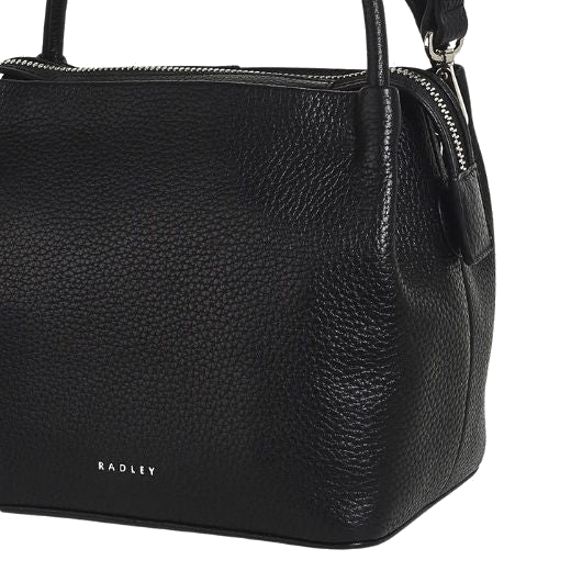 The Radley brand name is on the front of the Ivydale Road Small Black Zip-Top Cross Body Bag, embossed in silver foil.