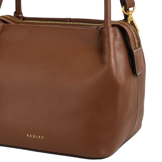 The Radley brand name is embossed in gold foil on the front of the Ivydale Road Small Saddle Zip-Top Cross Body Bag.