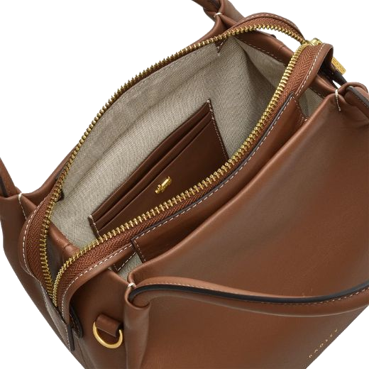 Inside the Ivydale Road Small Saddle Zip-Top Cross Body Bag is a leather patch with room for 3CC.