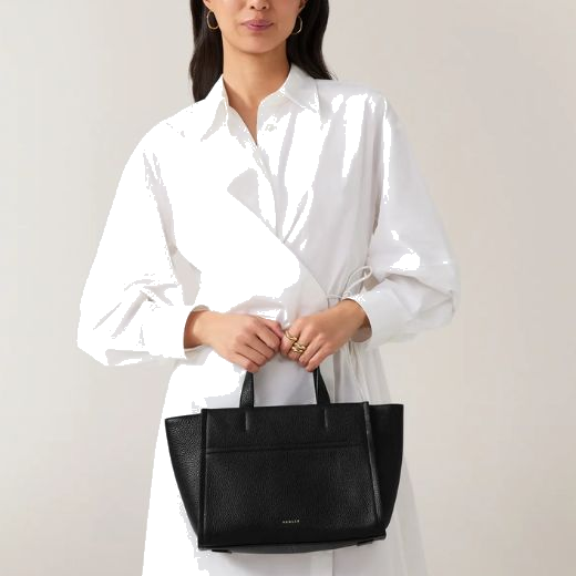 This Oak Street Black Leather Zip-Top Medium Grab Bag by Radley has top grab handles and a detachable cross body strap so you can wear it multiple ways.