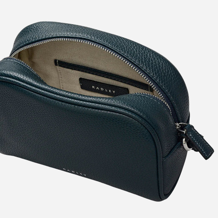 Inside the Radley The Daily Teal Small Zip Top Cross Body Bag.