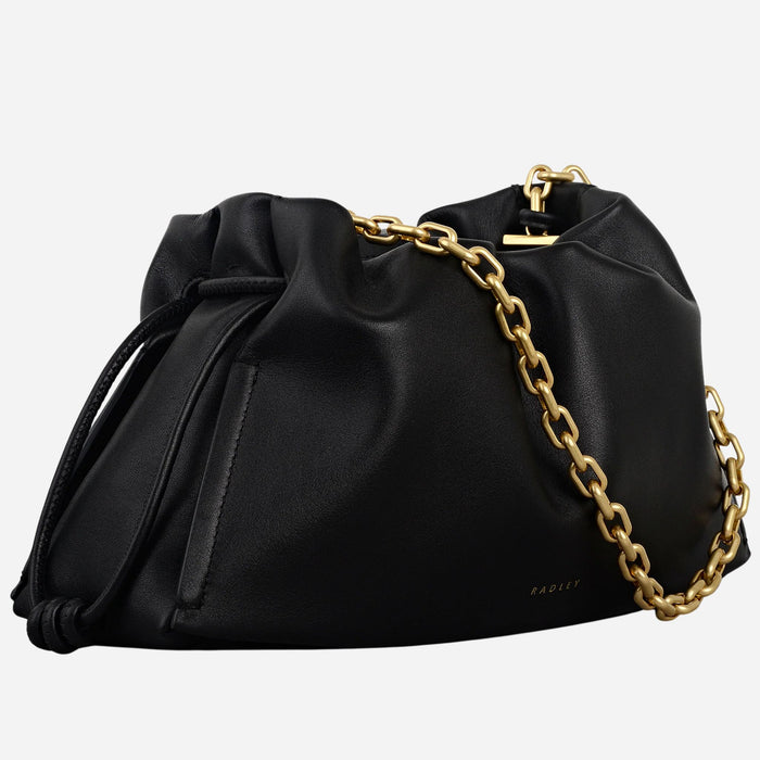 Side view of the Radley The Roxburgh Black Leather Small Chain Clutch Bag.