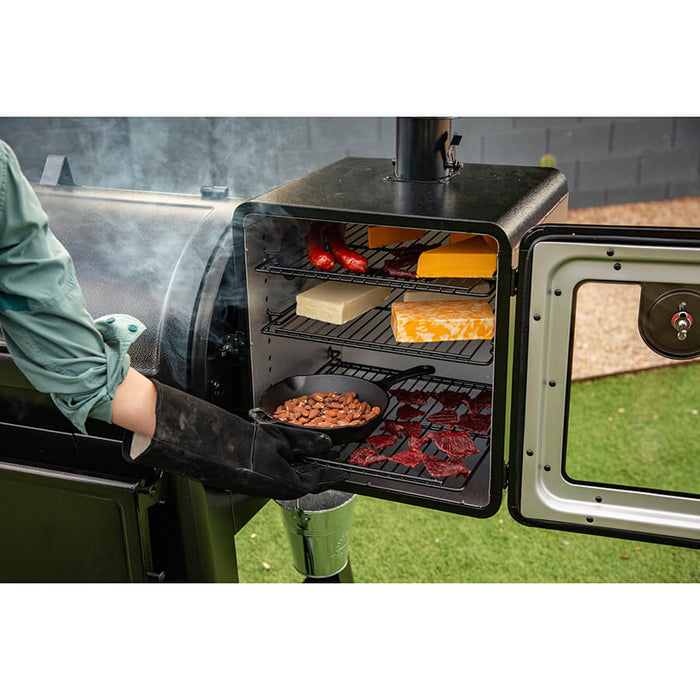 Meat beans and cheeses in smoker.