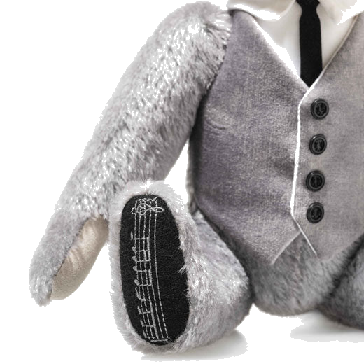 This Steiff James Bond Goldfinger 60th Anniversary Musical Teddy has the James Bond theme tune and is 5-way jointed.