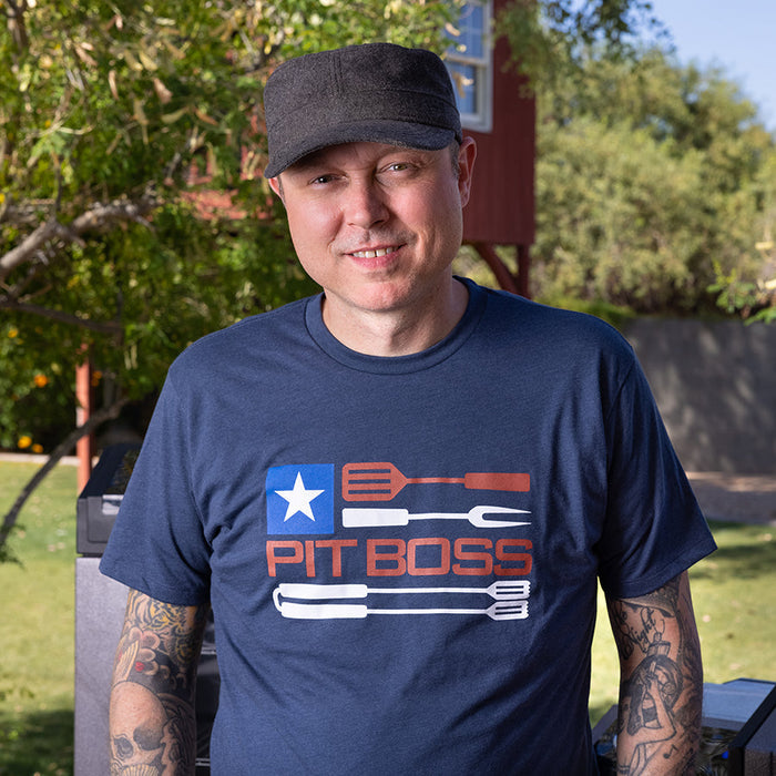 Navy heather Pit Boss Grills t-shirt with American flag and grilling tools graphic.