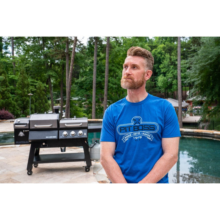 Royal Heather Pit Boss Grills Tools of the Trade Men's T-Shirt, worn by a man near a grill and pool setting.