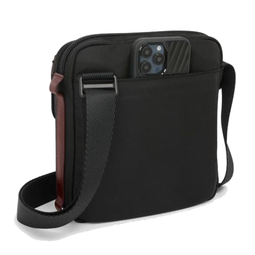 This Alpha Bravo Oxblood Junior Cross Body Bag by TUMI has a rear slip pocket so you can easily store your phone.