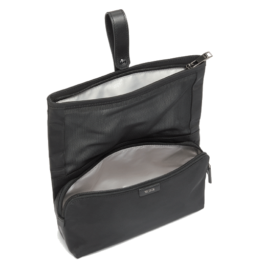 This Blake Cosmetic Bag in Black and Gunmetal by TUMI has a gunmetal plaque on the front with the brand name.