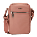 This TUMI Voyageur Dusty Pink Persia Cross Body Bag has a front zip pocket and a rear slip pocket.