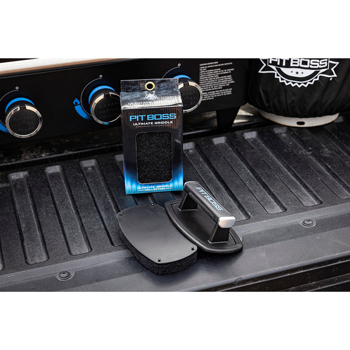 Ultimate Brush Replacement Pads displayed on the back of a pick up truck with griddle.