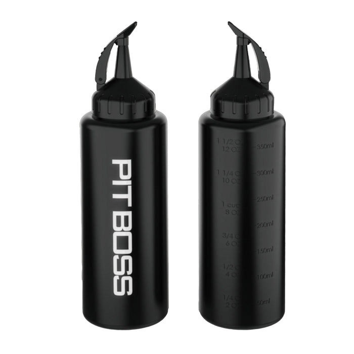 Pit Boss Ultimate Squeeze Bottle being used to squeeze sauce on sandwich.