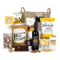 The Luxury Hamper by Virginia Hayward includes sweet and savoury snacks in a wicker basket.