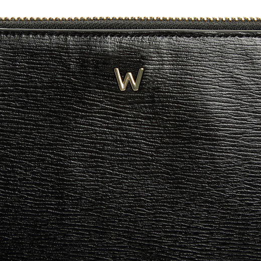 WOLF 1834's Black 'W' Laptop Sleeve features a gold W on the front.